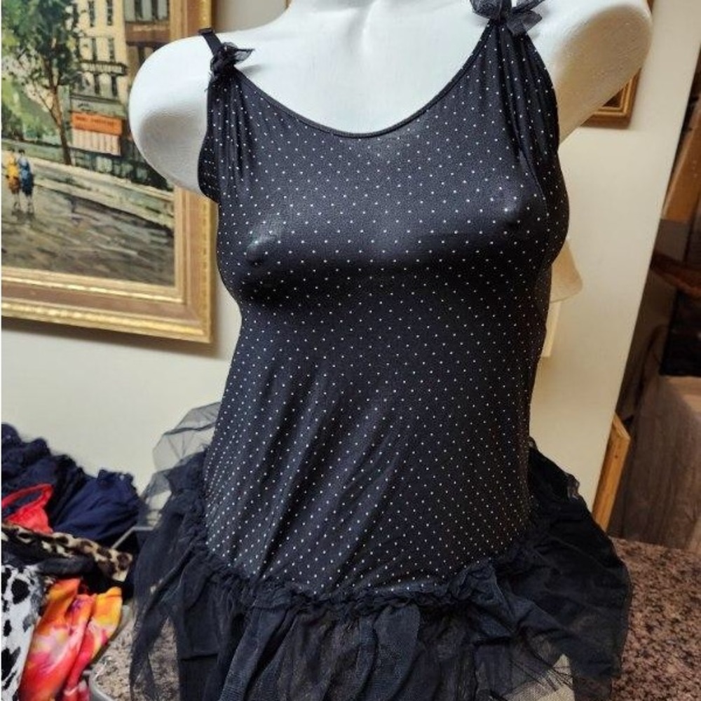 Victoria’s Secret black with polka dots and tutu type bottom detail. Bow detail